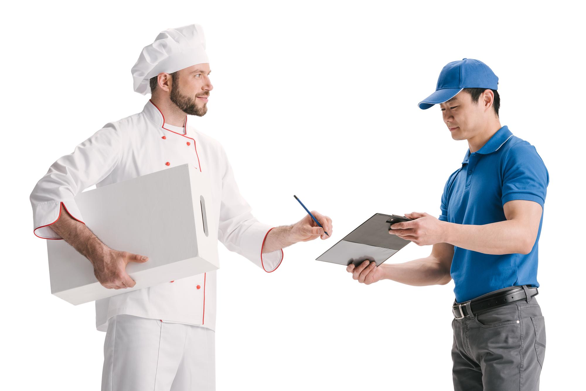 Chef handing over recipe dossier to client